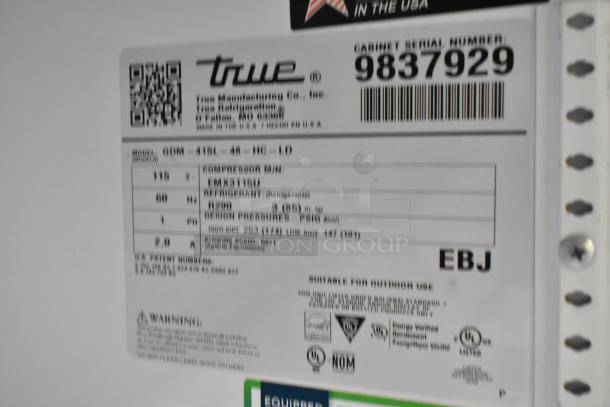 True GDM-41SL-48-HC-LD metal commercial cooler label, showing model, serial number 9837929, voltage, and compliance logos.