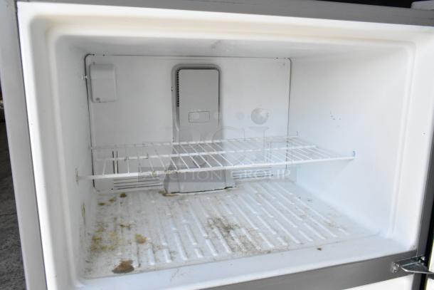 2019 Whirlpool WRT311FZDM01 stainless steel cooler with freezer, visible interior marks, 115V, 1 phase.