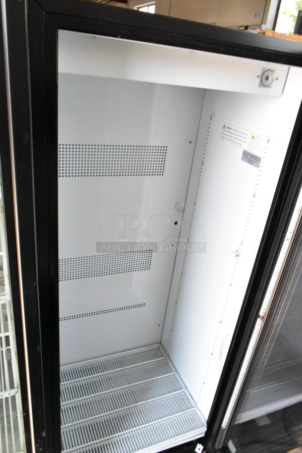 IDW G-12-F334B-HC single door cooler merchandiser, features poly coated racks, 115V, 1 Phase, in good condition.