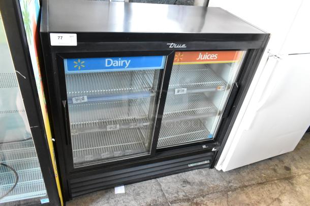 2018 True GDM-41SL-48-HC-LD cooler, 2 glass doors, poly-coated racks, "Dairy" and "Juices" signage, commercial use.