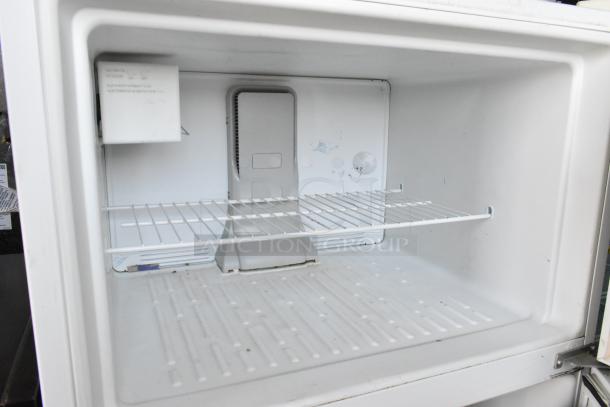 Maytag M1TXEGMYW01 metal cooler with freezer, featuring a single wire shelf, white interior, and 115 volts, 1 phase.