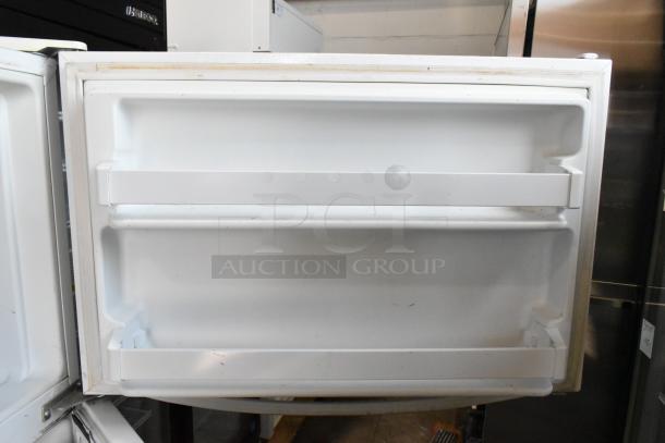 Maytag M1TXEGMYW01 metal cooler with freezer, white interior, open door showing shelves, 115V, 1 phase.