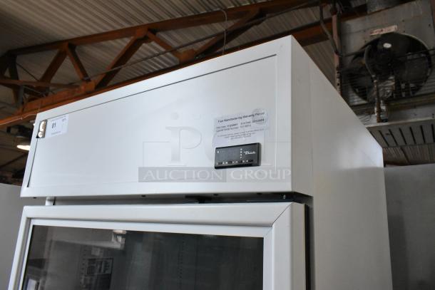 2021 True TSCI-600R-G-PH metal single door cooler merchandiser, 115V, poly coated racks, serial #1011019, warranty label shown.