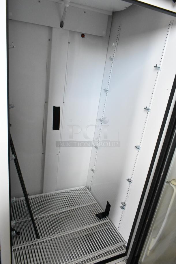 2021 True TSCI-600R-G-PH metal commercial single door cooler, poly coated racks, 115V, 1 phase, excellent condition.