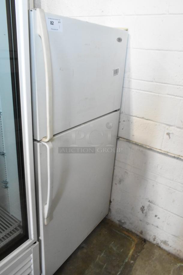 Whirlpool W1TXNMFWQ00 metal cooler with freezer, 115V, 1 phase, visible wear, label indicates auction item 82.