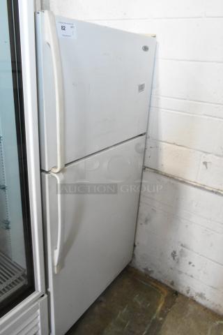 Whirlpool W1TXNMFWQ00 metal cooler with freezer, 115V, 1 phase, visible wear, label indicates auction item 82.