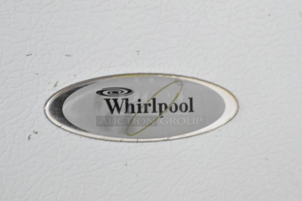 Whirlpool W1TXNMFWQ00 cooler detail showing logo. Model includes freezer, runs on 115 volts, single phase power.