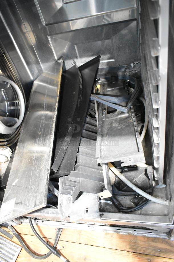 Two Rational iCombiPro convection ovens, stainless steel, electric, 440/480V, parts visible, needs assembly.