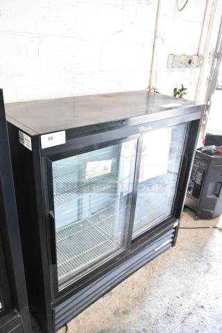 True Metal Commercial 2-Door Cooler Merchandiser, features poly-coated racks, 115 volts, 1 phase, labeled with model info.