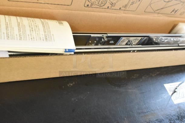Brand new bracket in box with instruction manual. Includes mounting hardware. Box shows assembly diagrams.