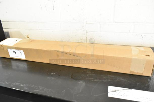 Brand new bracket in sealed box, item 89. Box has labels with auction details.