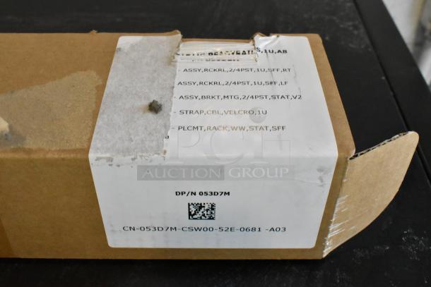 Brand new bracket in sealed box, showing part number DP/N 053D7M and package label details.