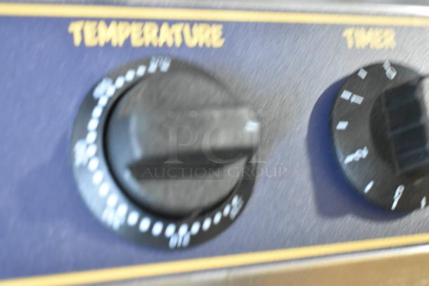 Carnival King 382WSM waffle maker controls, showing temperature and timer knobs. Stainless steel, new, with minor dents.