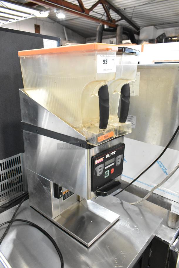 Bunn MHG stainless steel countertop coffee grinder with dual hoppers, 120V, 1 phase. Clean surface, clear labels visible.