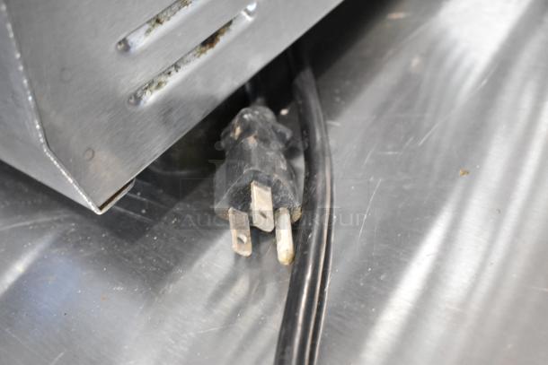 Bunn MHG stainless steel commercial coffee grinder plug and wiring on countertop, 120 volts, 1 phase, used condition.