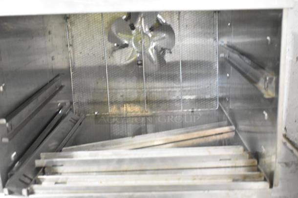 Weston 74-1001-W stainless steel countertop food dehydrator, interior view showing fan and racks, 120 volts, 1 phase.