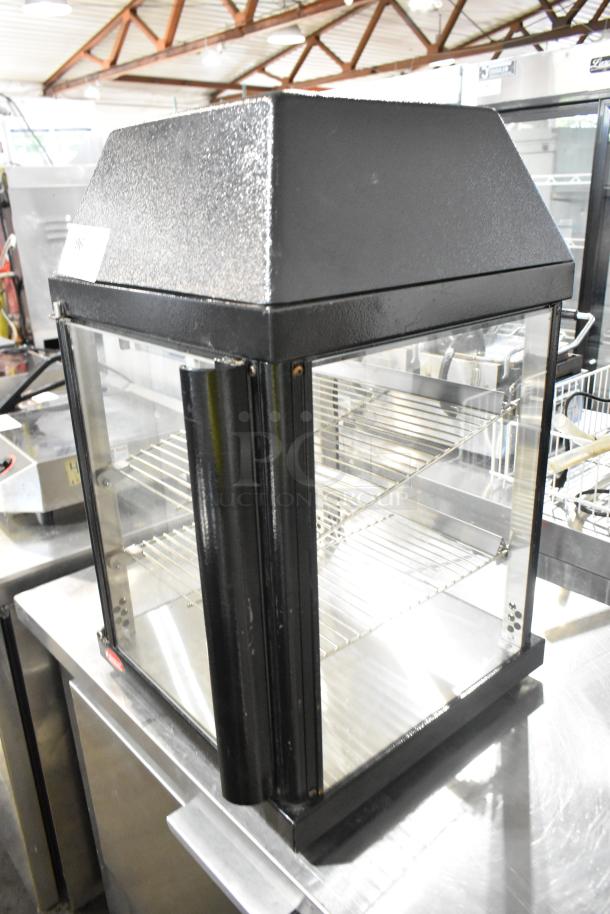 Hatco MDW-1X heated holding case, black metal, glass sides, two shelves. 120 volts, 1 phase, good condition.