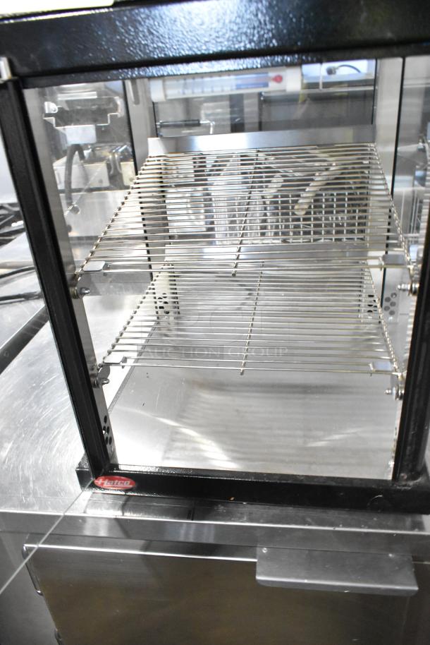 Hatco MDW-1X Metal Countertop Heated Holding Case, 120V, 1 Phase; glass panels, wire shelves, black frame.