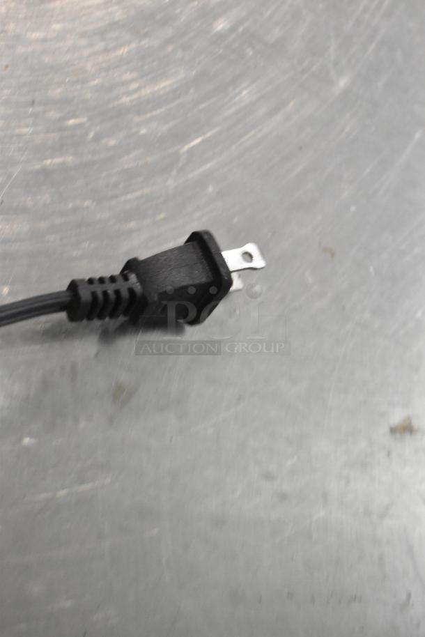 Close-up of a power plug for a Star Blue SB-SW2093 Metal Countertop Waffle Maker, 120 Volts, 1 Phase.