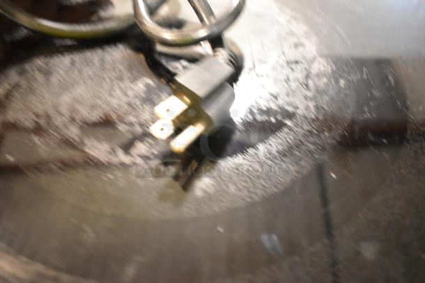 Blurry close-up of plug and cord for CookTek MC1800 stainless steel induction range. 120 volts, 1 phase.
