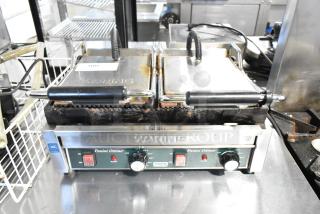 Waring WPG300 Stainless Steel Commercial Double Panini Press, 240V, worn condition, with control knobs and visible branding.