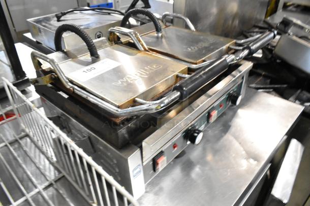 Waring WPG300 stainless steel commercial double panini press, 240V, in good condition, visible branding and controls.