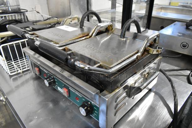 Waring WPG300 stainless steel commercial double panini press, 240V, 1PH. Visible wear, operational controls intact.