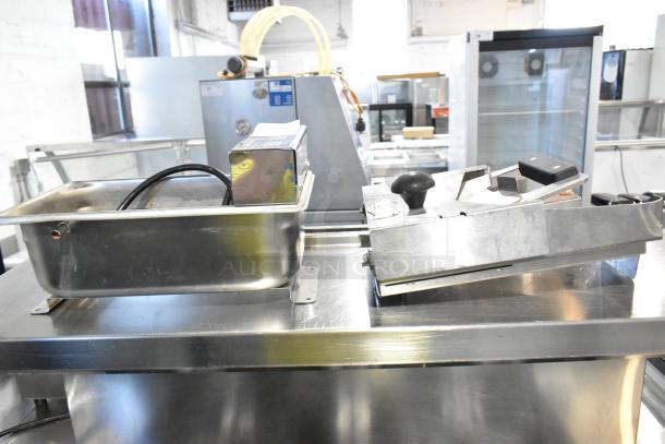 Evaporway DM06M-1S Evaporator Pan, stainless steel, with cables, alongside Bagel Saber slicer, metal finish.