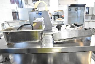 Evaporway DM06M-1S Evaporator Pan, stainless steel, with cables, alongside Bagel Saber slicer, metal finish.