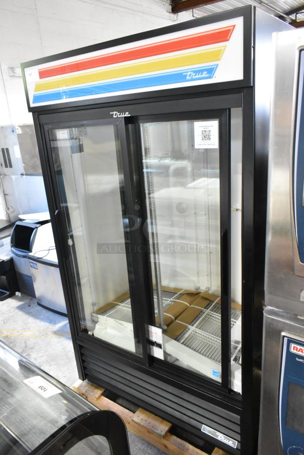 True 2-door reach-in cooler merchandiser with poly-coated racks, brand new with scratch and dent condition, 115 volts, 1 phase.