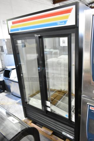 True 2-door reach-in cooler merchandiser with poly-coated racks, brand new with scratch and dent condition, 115 volts, 1 phase.