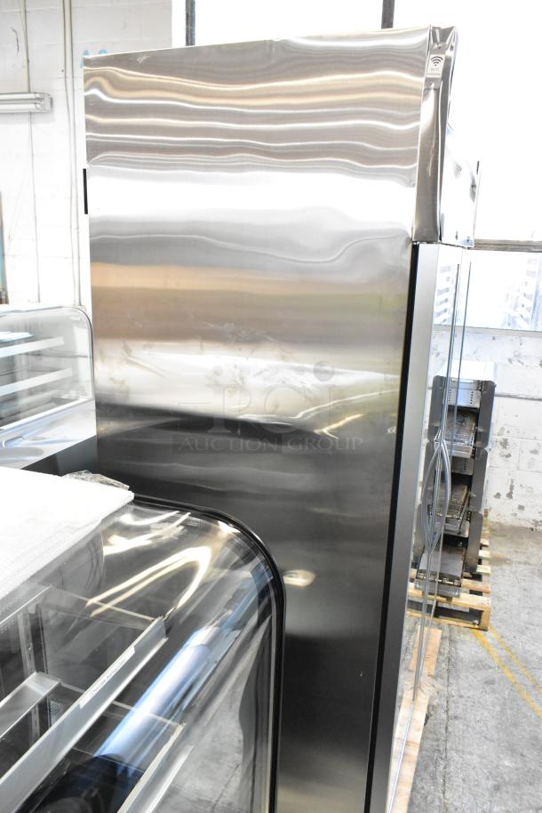BRAND NEW Avantco 178Z2RGHC Stainless Steel Commercial 2 Door Reach In Cooler, poly coated racks, 115V, 1 Phase, with minor dents.