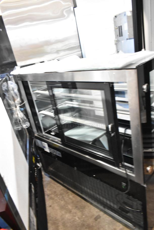 Brand new Avantco 193BCD48B 48" curved glass black dry bakery display case, 2023 model, 115 volts, 1 phase, scratch and dent.