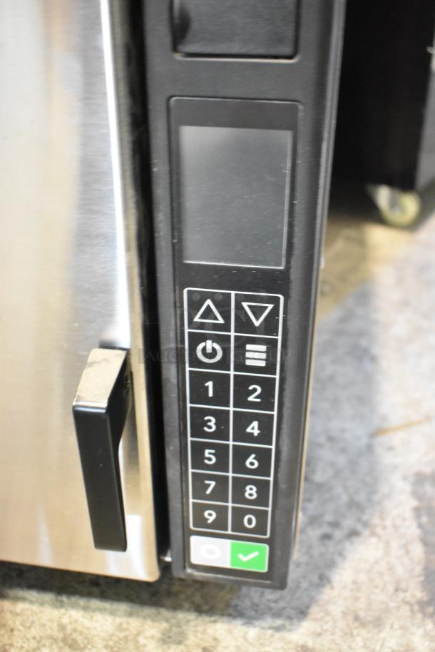 BRAND NEW SCRATCH AND DENT 2023 XpressChef JET19 high-speed cooking oven, stainless steel. Touch controls visible.