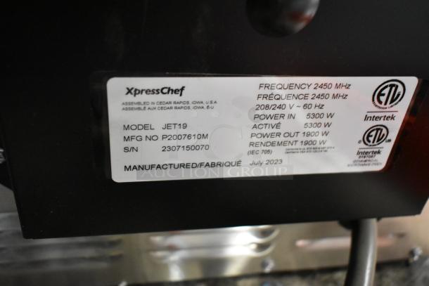 XpressChef JET19 stainless steel commercial oven label, showcasing model, serial number, and manufacturing date, July 2023.