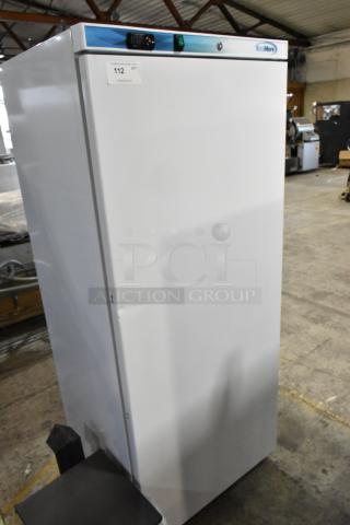 Brand new KoolMore KM-FMD20WH commercial freezer, single door, metal, with poly coated racks, 115V, dent visible.