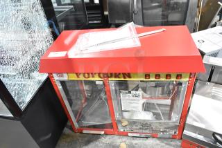 BRAND NEW Carnival King 382PMW17R 8 oz. Popcorn Machine, red, with warming merchandiser, 120V, visible operating instructions.