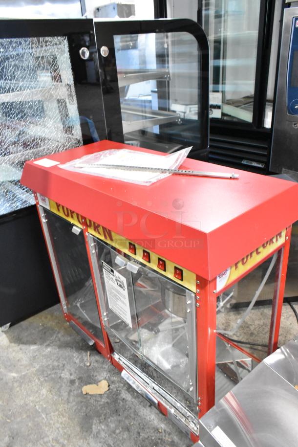 BRAND NEW Carnival King 382PMW17R popcorn machine with 8 oz. capacity, warming merchandiser, minor cosmetic scratch and dent.