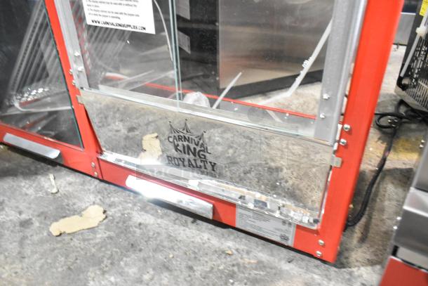 Brand new Carnival King 382PMW17R popcorn machine. Features include heating/holding merchandiser. Minor scratches visible.