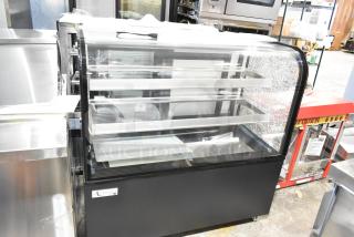 Brand new Avantco 193BC48HCB 48" curved glass refrigerated bakery display case. Note visible glass damage. 115V, 1-phase.