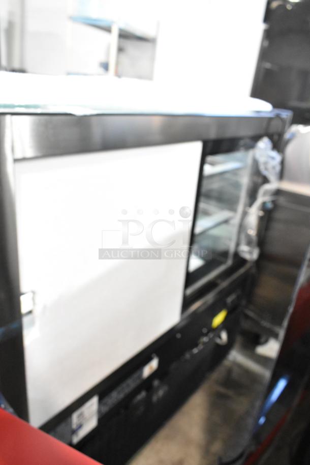 BRAND NEW Avantco 193BC48HCB 48" refrigerated bakery display case, curved glass, black finish, visible scratches. 115V, 1 phase.