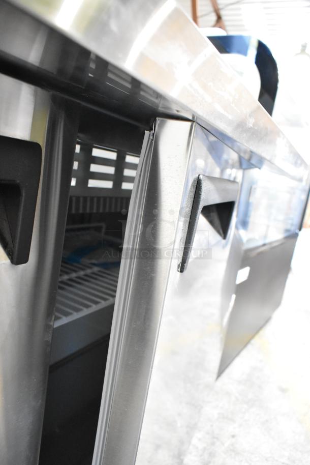Avantco 178APT60MHC stainless steel refrigerated sandwich prep table, brand new, with minor dents. Commercial casters included.