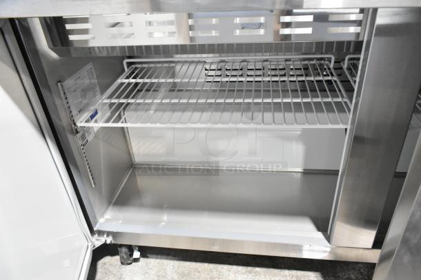 Brand new Avantco 178APT60MHC stainless steel 2-door mega top sandwich prep table with casters, internal shelf shown.