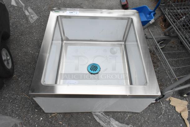 Brand new Regency 600SM242412 stainless steel floor mop sink, 24"x24"x12" bowl, 16-gauge, scratch and dent, notched front.