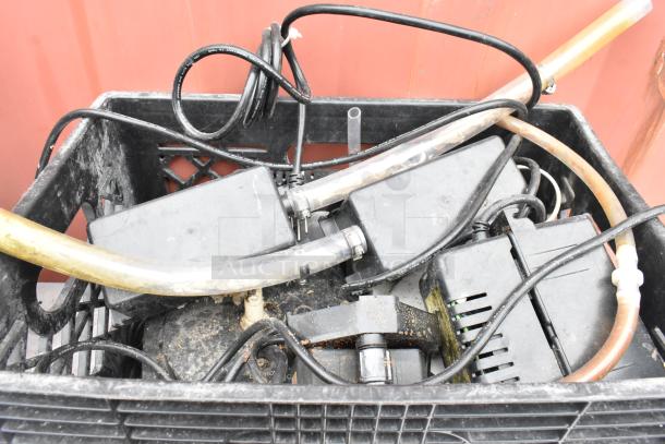 Stainless steel table with metal under shelf, includes various cables and electronic components on shelf. Moderate wear.