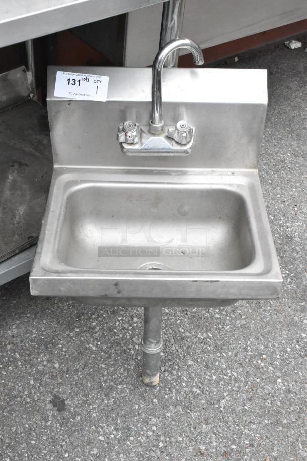 Stainless steel single bay sink with faucet and handles, in used condition. Visible auction tag with quantity "1."