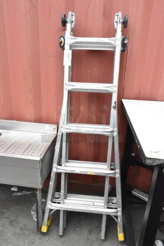 Gorilla Ladders metal convertible ladder, 300 lb capacity, shown in A-frame position. Metal construction, rubber foot grips visible.