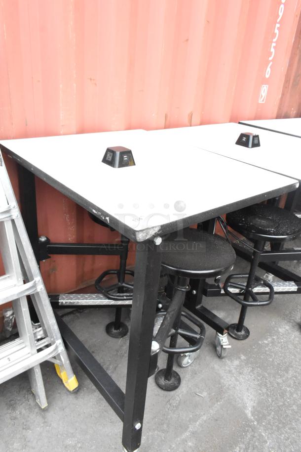 Three tables with attached black stools, sizes 30x36x46 and 51x36x46, featuring integrated outlets.