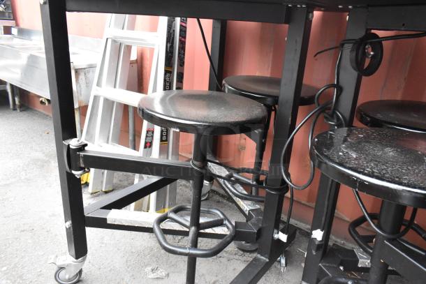 Three tables with attached stools, black finish, varying sizes. Includes 30x36x46, 51x36x46 dimensions. Sturdy condition.