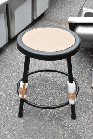 Brand new metal stool, scratch and dent condition, round seat, black frame, protective packaging on legs.